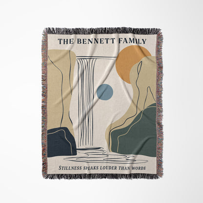 Woven blanket with abstract design and text 'The Bennett Family' on a white background