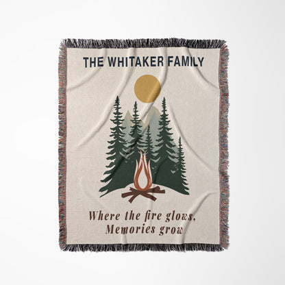 Personalized blanket with campfire and trees design, featuring 'The Whitaker Family' text.
