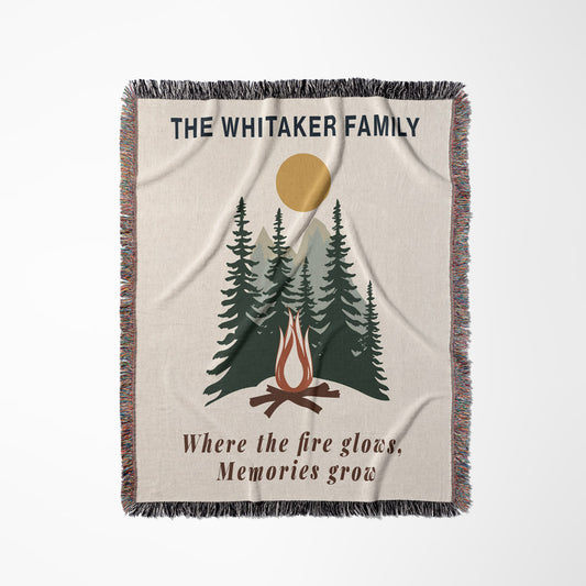 Personalized blanket with campfire and trees design, featuring 'The Whitaker Family' text.