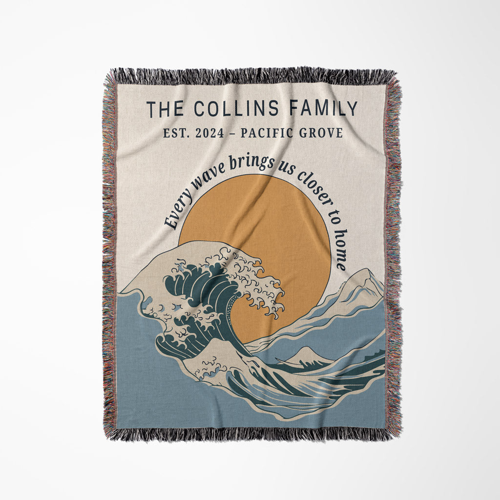 Personalized blanket with wave design and text on a beige background